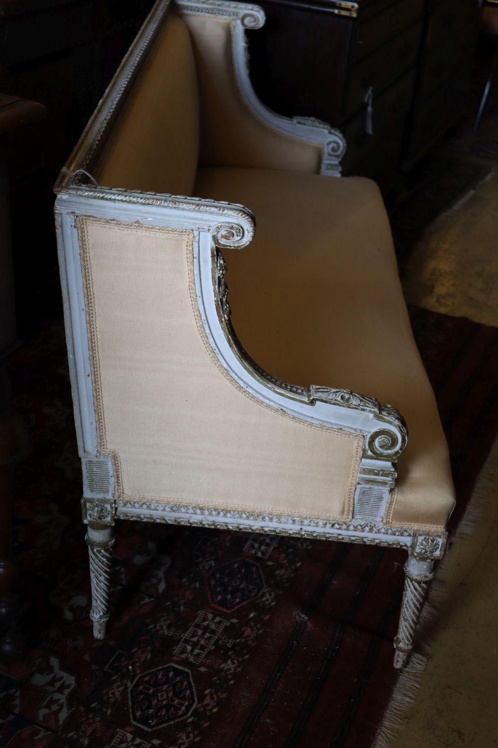 A French painted parcel gilt canapé, width 127cm depth 54cm height 75cm